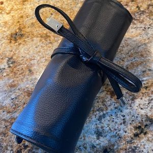 Younique leather roll up makeup brush holder.
